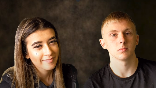 Two students look straight into the camera, there is a dark background behind them.
