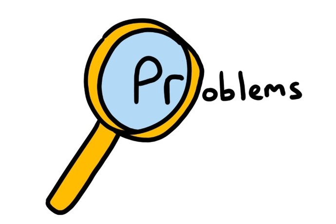 A magnifying glass hovers over the word 'Problems'