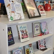 A close up photo of a selection of books by female authors celebrating International Women's Day at Victory Academy