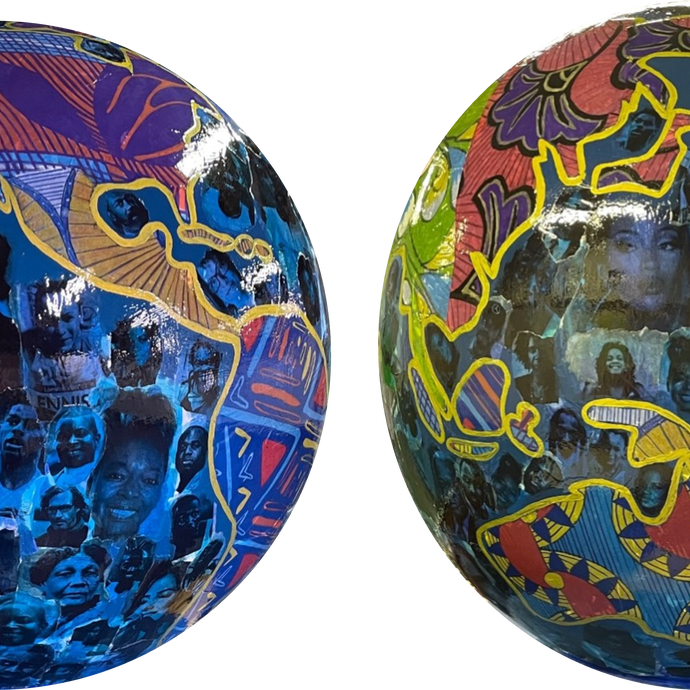 Two globe art sculptures with images of Black Britons on them. 